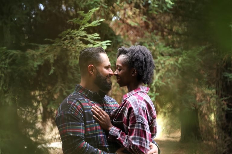 Multiracial couple hugging