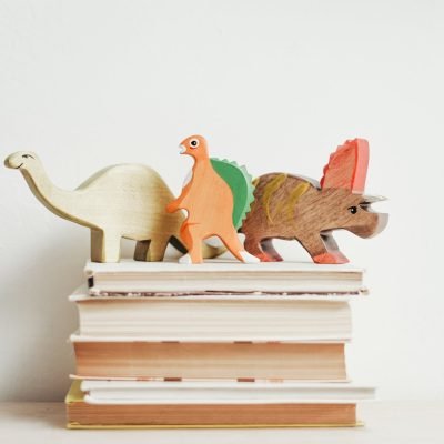 three wooden dinosaur